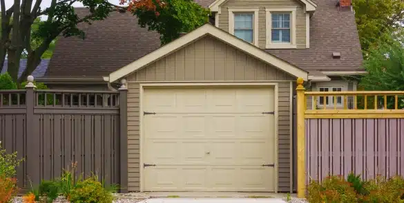 Technician doing garage door repair in Douglasville, Georgia.