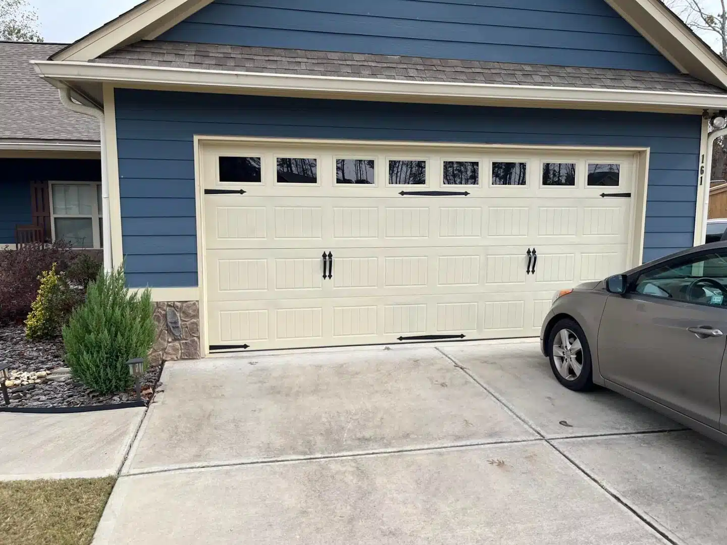 Perimeter Garage Doors technician working on a residential garage door in Villa Rica, GA